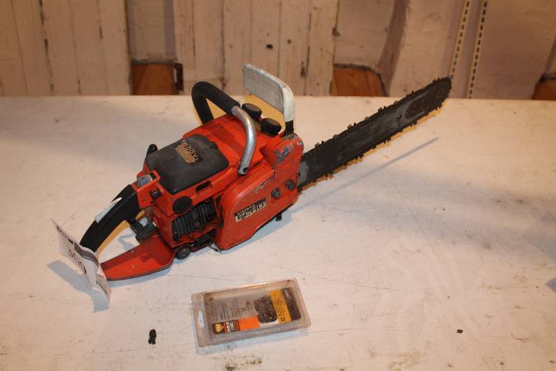 lot 309 image: ECHL gas powered chainsaw turns over unsure running. condition comes with extra blade.
