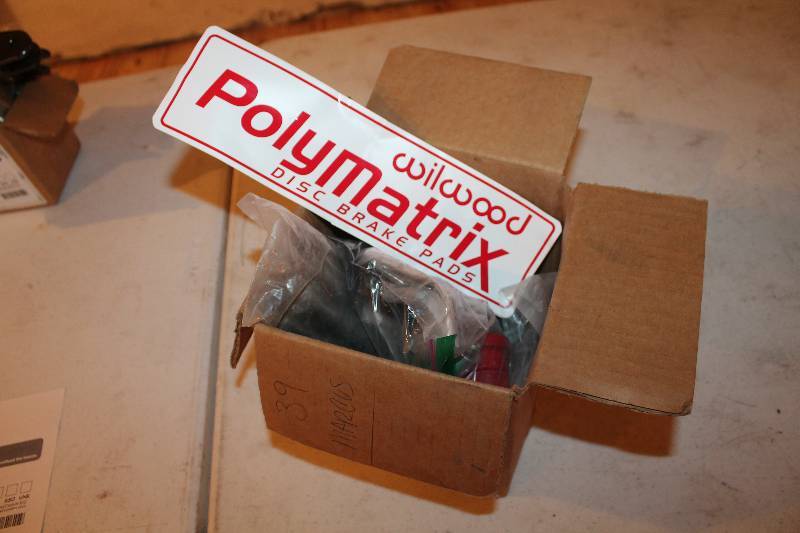 lot 334 image: Miscellaneous race car parts includes spacers bearings wheel studs and bushings.