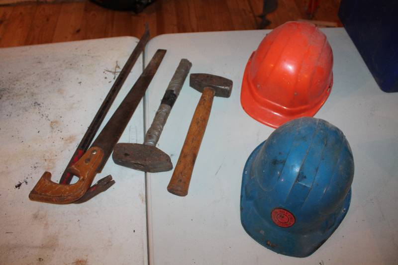 lot 342 image: Hammers hardhats crowbar saw. Includes vintage 49ers hat.