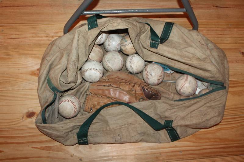 lot 347 image: Baseball bag full of softballs and mitt