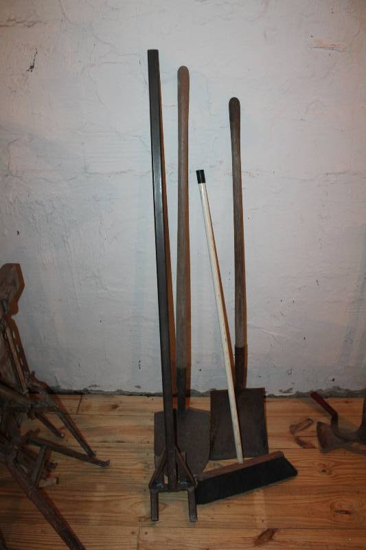 lot 349 image: Lot of shovels, broom and lumber removal tool.