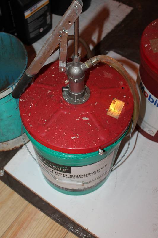 lot 371 image: 5 gallon pail of Lube-tech Premium Hydraulic Fluid. Comes with pump