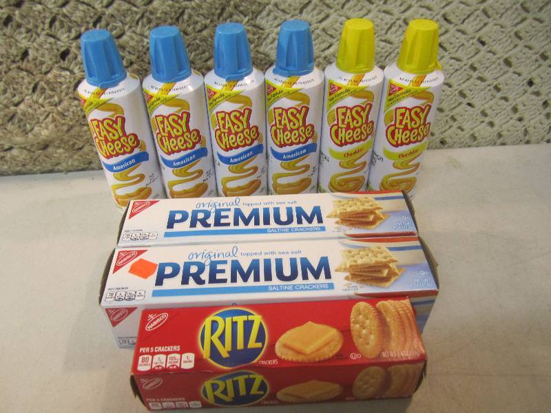 lot 133 image: 6 Cans of Easy Cheese and Crackers ...