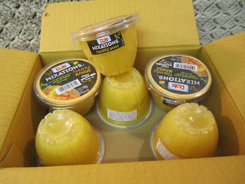 lot 235 image: Case of 12 Dole Mixations Pineapple...