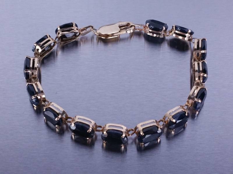 lot 35 image: 14 Carat Natural Sapphire Tennis Bracelet in Yellow Gold