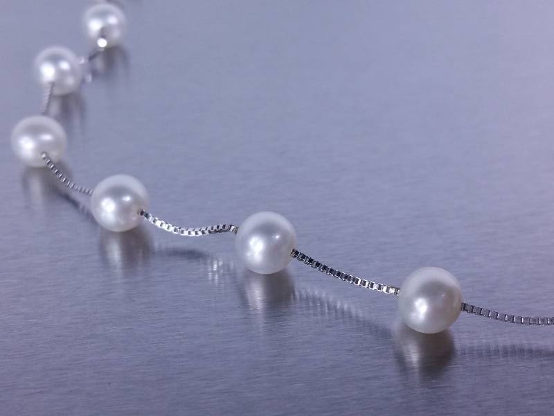 lot 48 image: Natural 10 Strand Rice Pearl Estate Necklace 14k