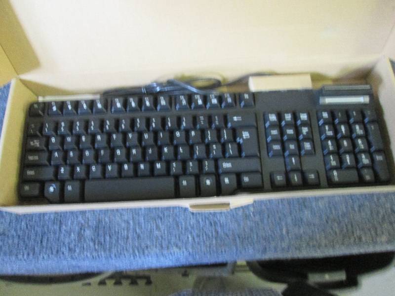 lot 55 image: keyboard with smart card reader...