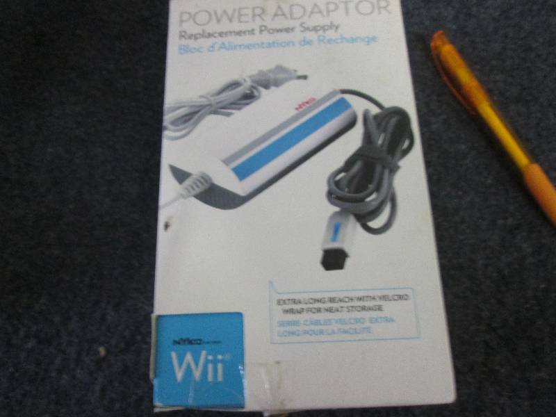 lot 71 image: Wii replacemnt power supply...