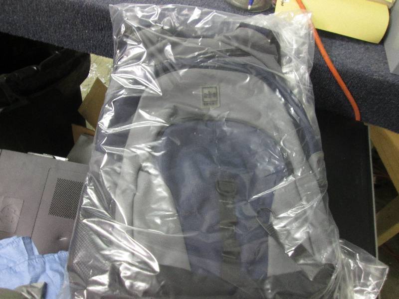 lot 157 image: dark blue bagpack...