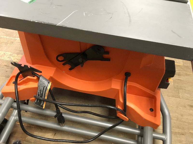 lot 19 image: Ridgid 15 Amp 10 in. Heavy-Duty Portable Table Saw with Stand Used in working conditions