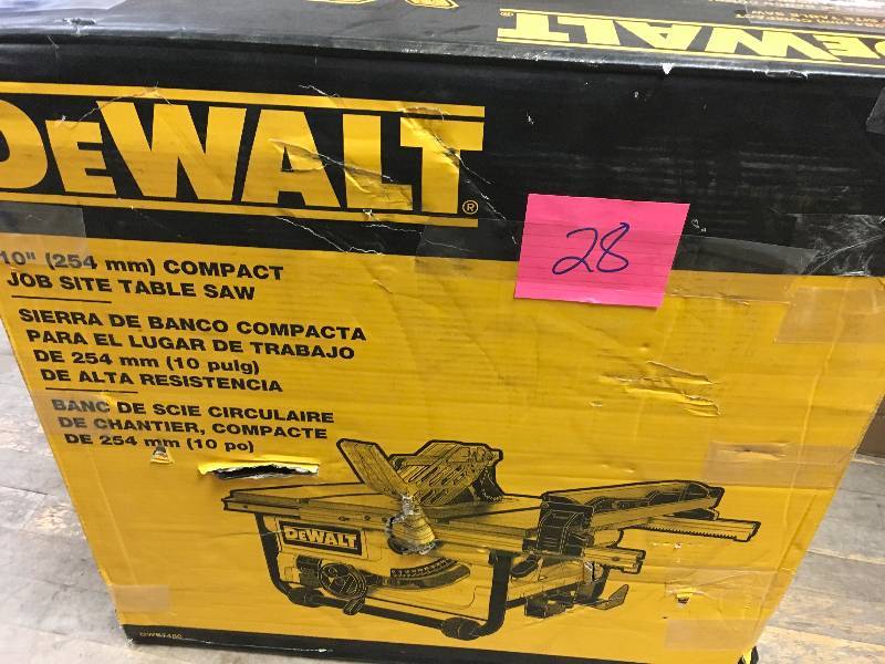 lot 28 image: Dewalt 15 Amp 10 in. Compact Job Site Table Saw with Site-Pro Modular Guarding System used in working conditions