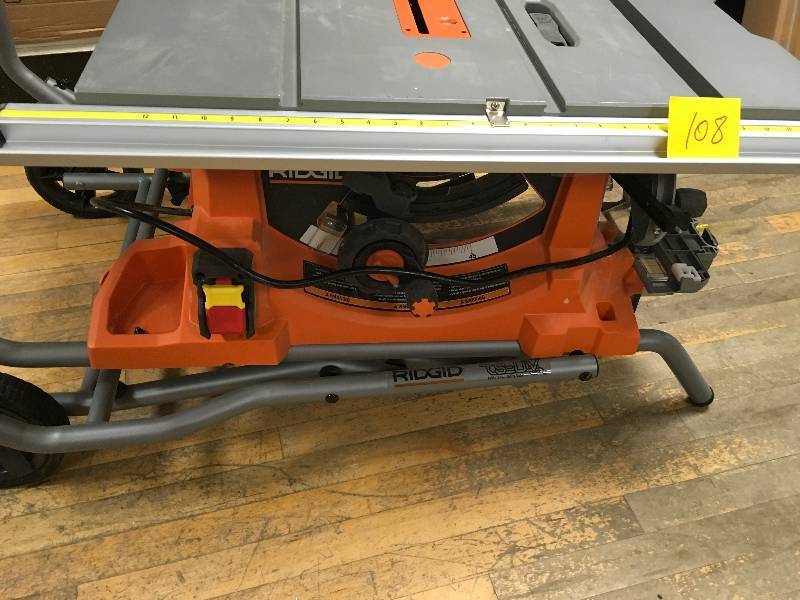 lot 108 image: RIDGID 15 Amp 10 in. Heavy-Duty Portable Table Saw with Stand used in like new condition