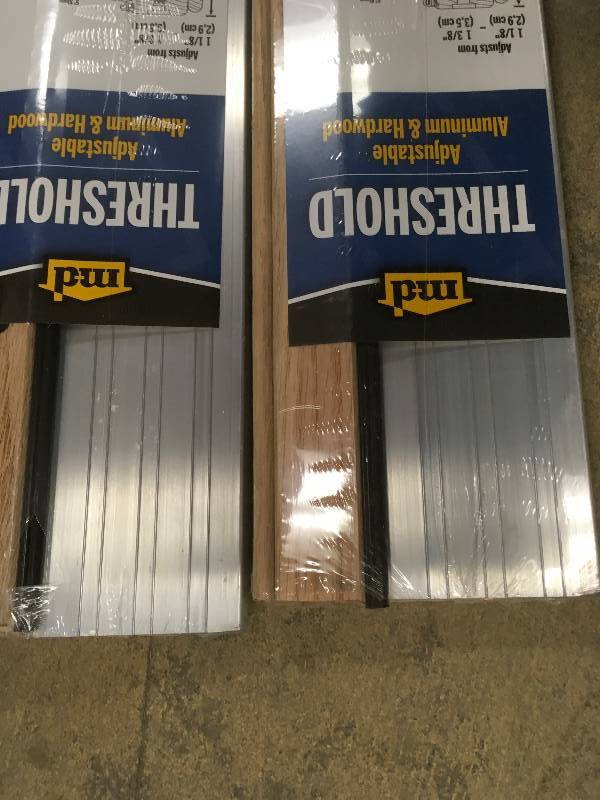 lot 67 image: M D Building 4-916 in. x 36 in. Satin Aluminum and Oak Adjustable Threshold Lot of 2