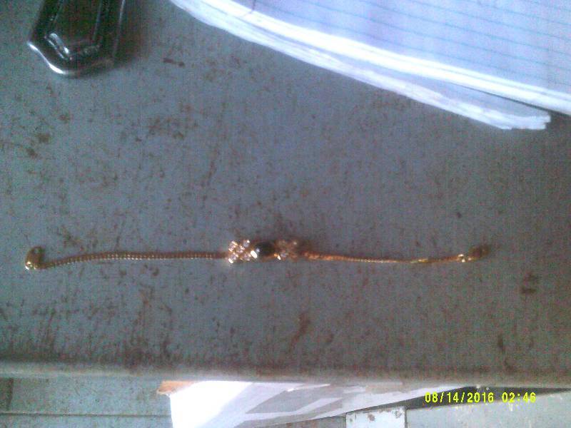 GOLD BRACELET WITH BLACK AND DIAMOND STONES