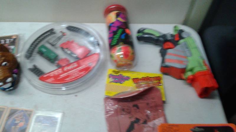 lot 55 image: Box Filled With Some Mixed Toys, Some New, Some Collectible, Ohio Art Tin Top