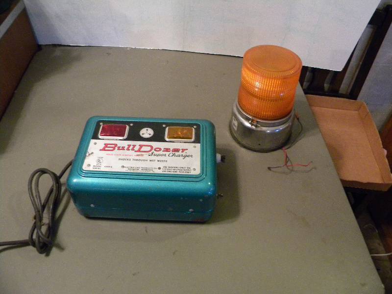 lot 101 image: Electric Fence Charger & Safety Light