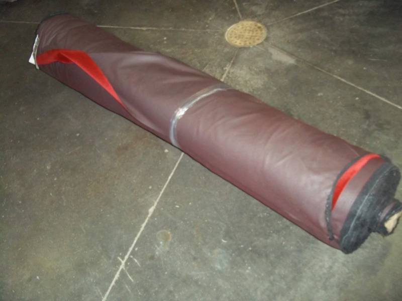 lot 92 image: Roll of Red Fabric 27.7 Yards