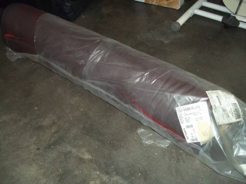 lot 118 image: Roll of Red Fabric 30.2 Yards