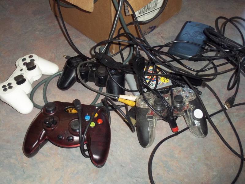 lot 183 image: Play Station Game Controllers, Power Adapter, Scientific Calculator