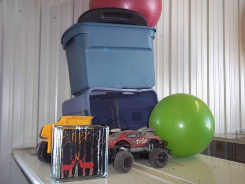 lot 186 image: 2 Totes, Hair Dryer, Curling Iron, Electric Razor, 2 Bouncy Balls, RC Car & Misc.