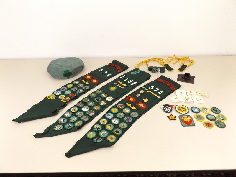 lot 27 image: Large Lot of Vintage Girl Scout Badges, Sashes, Pin, etc. 
