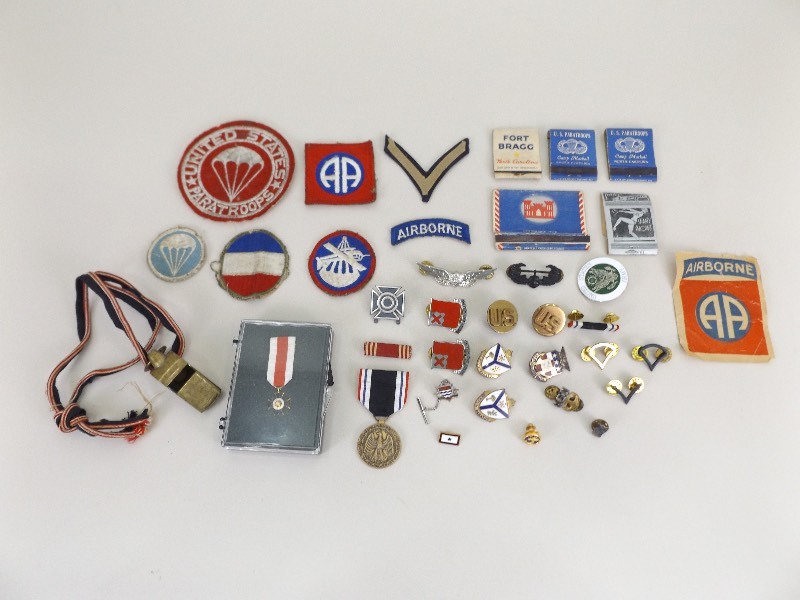 lot 29 image: Large Lot of Vintage U.S. Military Medals, Pins, Badges, etc.