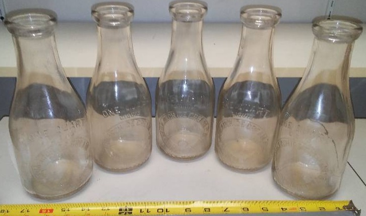 lot 162 image: Monarch ice cream Company, (5), glass quart milk containers