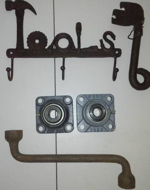 lot 207 image: Cast tools, cast coat hooks and two new bearings