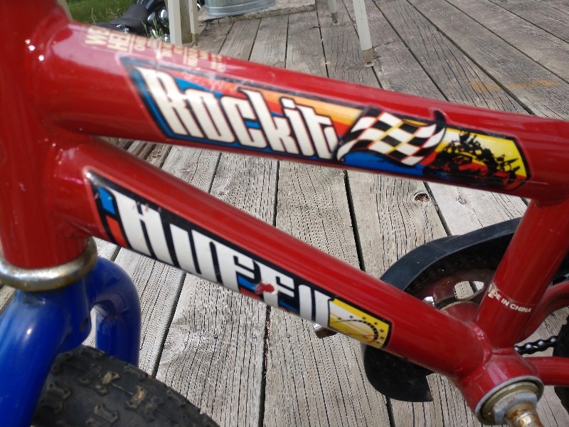 lot 76 image: Huffy Rock-It 12 Bicycle w Schwinn Training Wheels and Memorex Portable Karaoke System