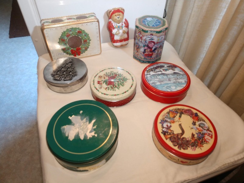 lot 80 image: Christmas Themed Tins Oreo 1912 from 1990, Keller-Charles of Philadelphia Momma Teddy Bear Tin, Andes Creme De Menthe Thins 1996, Silver Christmas Tree Tin, Under the Christmas Tree Tin, Green Tin, Ice SkatingSleigh Ride Tin, Holiday Wreath Tin