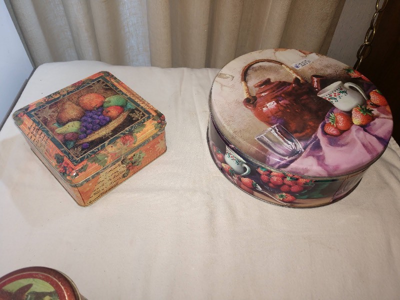 lot 101 image: Orange Harvest Fruit Display Tin, Large Round Tin w Lilac Tablecloth, Vintage Coca-Cola Tin w Coca-Cola Lady In Victorian Red Dress