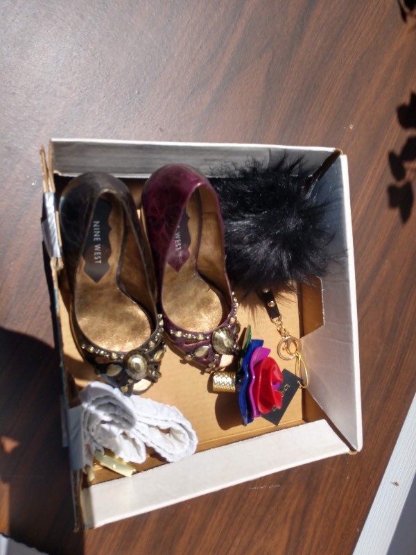 lot 108 image: Doll Wearing Cream and Magenta Gown. White Rouged Belt, Pair of Nine West Burgundy Heels, Black BEBE Pom Pom Key Ring, and a Flower Trinket