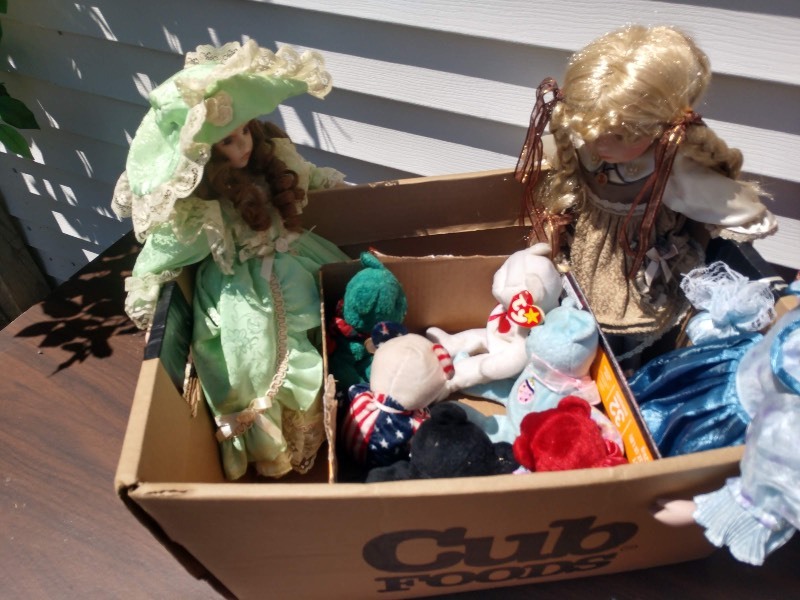lot 110 image: Doll in Green Victorian Era Dress, Six Beanie Babies, Blonde Native Doll, Blonde Doll in Blue Dress, Doll in Navy Blue V-Neck Dress w Flowers at the Hem and Long Sleeve Floral Knit Under, and Three Stuffed Animals