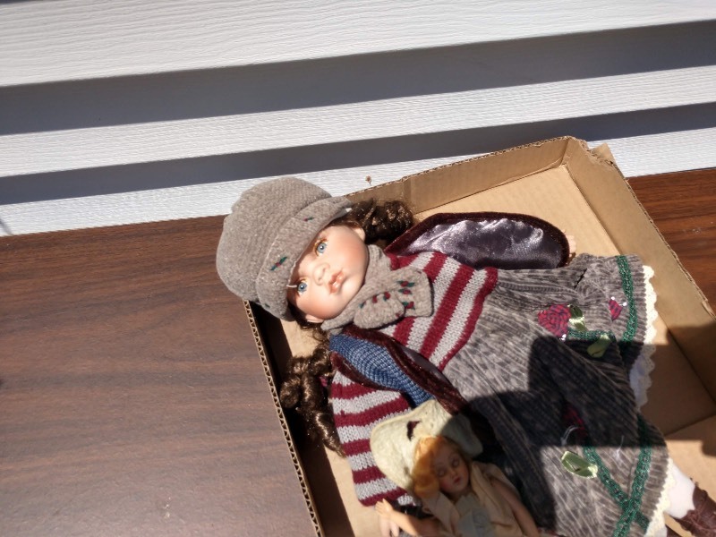 lot 114 image: Brunette Doll in Maroon and Brown Grey Striped Top Brown Grey Bottom Sweater Dress and Strawberry Blonde Doll in Yellow Floral Gown