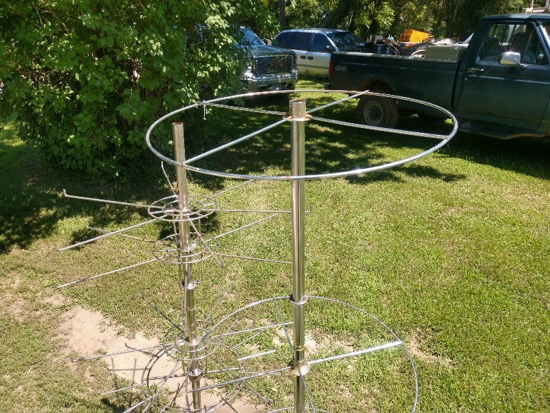 lot 48 image: Four Level Revolving Tie and Belt Rack and Three Tier Round Revolving Garment Rack