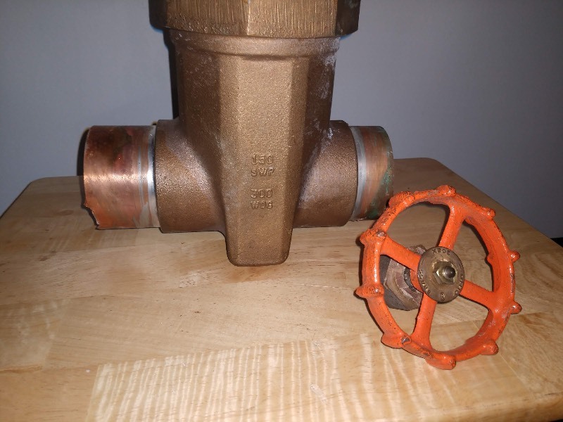 lot 3 image: Vintage Brass Gate Valve, Orange Gate Valve Hand Wheel, and Sprinkler Dain Sign