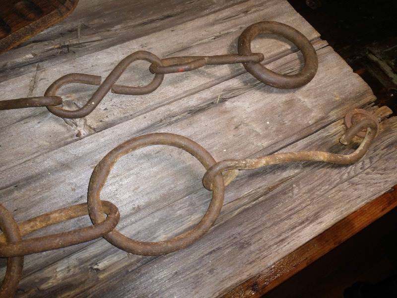 lot 34 image: Unique Curved Wood Saddle Stirrup Carved into Decor, Hard Forged Chains w Large Links (2)