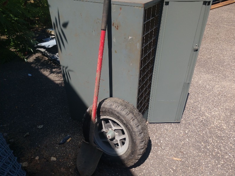lot 71 image: Industrial 48 Cubby Hole Locker, American Racing Tire P20570R13, and Vintage Shovel