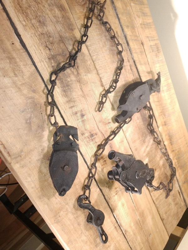 lot 84 image: Antique Cast Iron Farm Pulleys and Chain