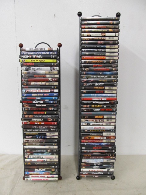 lot 62 image: Lot of Approx 90 Assorted DVDs wDisplay Stand