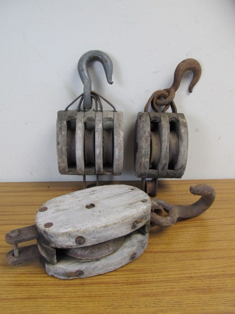 lot 87 image: 3 Antique WoodCast Iron Pulleys - Single Double & Triple