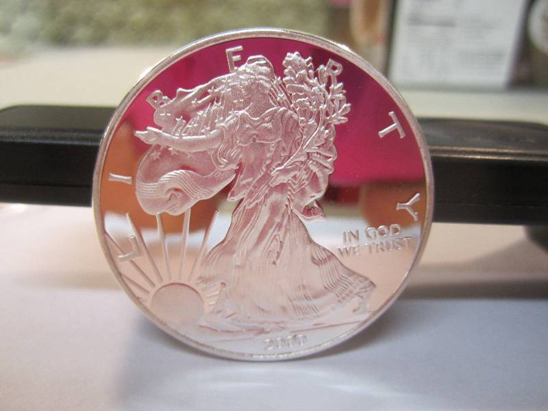 lot 10 image: 2000 1 Ounce Fine Silver One Dollar...