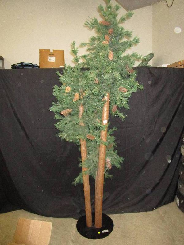 lot 9 image: Big fake pine tree ( 3 tree bases- overall 1 medal base see picture) 88 tall