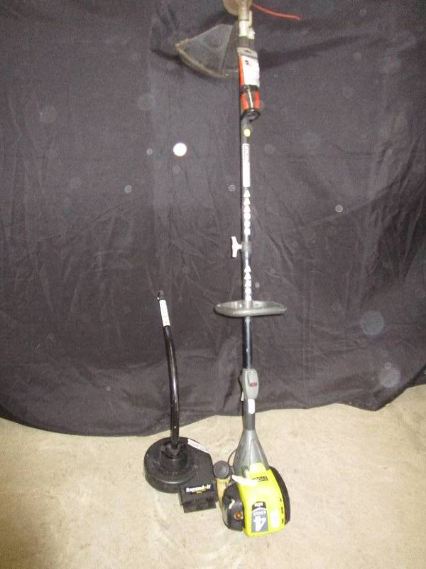 lot 11 image: Ryobi 4 cycle S430 trims and edges comes along with attatchment system blower