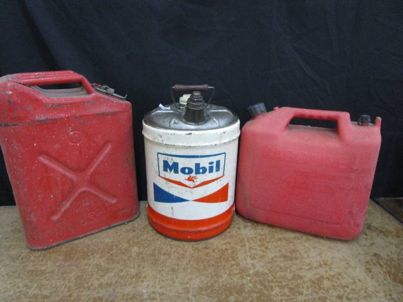 lot 91 image: Mobil Gas Can with Wood Handle and Other Gas Cans