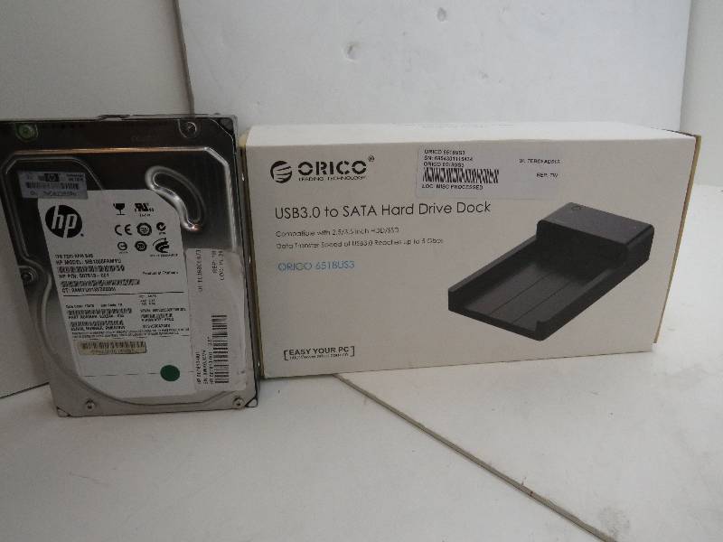 lot 3 image: Sata Hard drive Dock with a 1TB hard drive