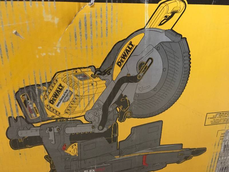 lot 7 image: DEWALT FLEXVOLT 120-Volt MAX Lithium-Ion Cordless Brushless 12 in. Sliding Miter Saw w AC Adapter, Batteries 2Ah and Charger in good conditions