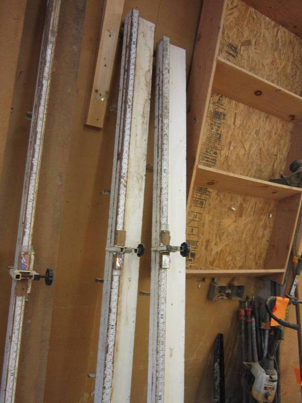 lot 18 image: 2 white 8 foot cut off miter saw st...