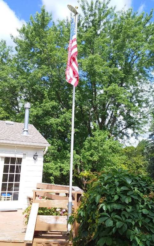 lot 1 image: 20 Telescoping Flag Pole With Brass Ball, Solar Light & Flag