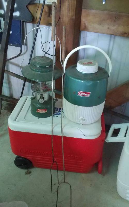 lot 12 image: Igloo Cooler On Wheels, Insulated Beverage Dispenser, Coleman Lantern (No Globe), 2-Marshmallow Roasters